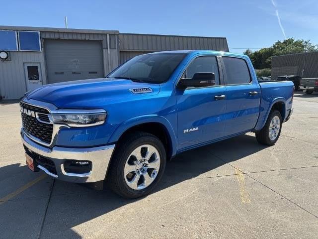 2025 RAM Ram 1500 RAM 1500 BIG HORN CREW CAB 4X4 5'7' BOX in Hydro Blue Pearl-Coat Exterior Paint — front three-quarter view