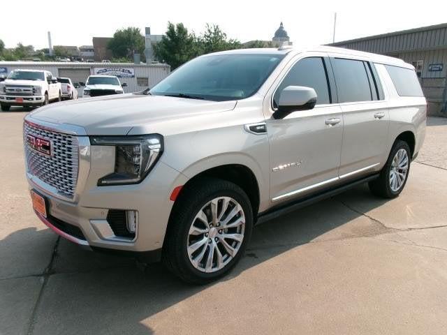 2024 GMC Yukon XL 4WD Denali in Pearl Beige Metallic — front three-quarter view