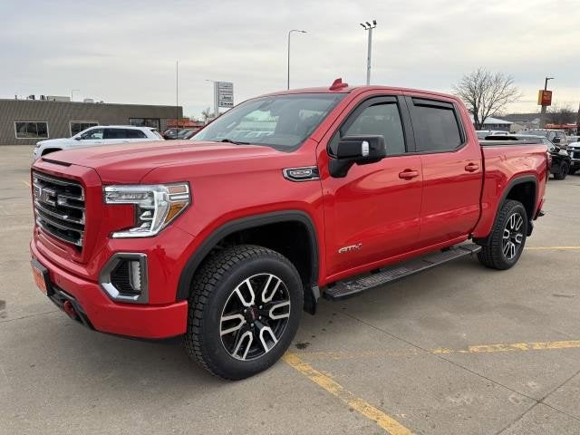 2021 GMC Sierra 1500 AT4 in Cardinal Red — front three-quarter view